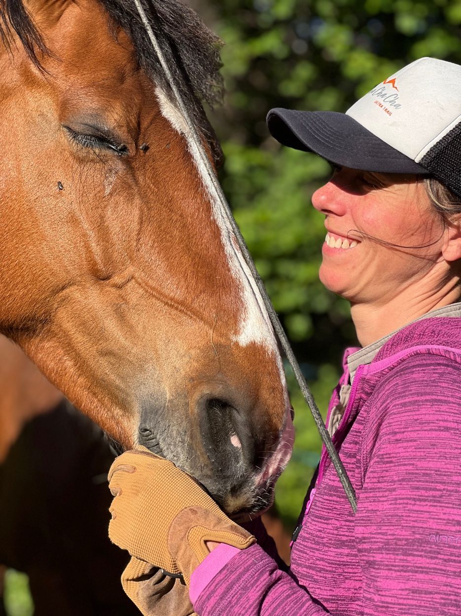 Sarah with her horse in summer, Val des Bagnes valley, Valais Switzerland